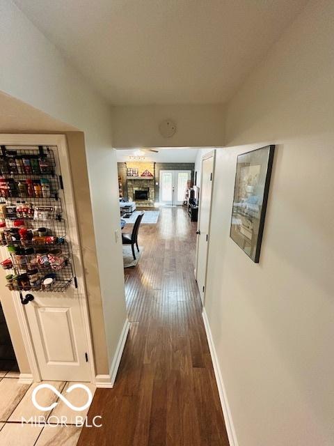 209 Brighton Ct, Greenwood, IN 46143 - corridor with wood finished floors and baseboards