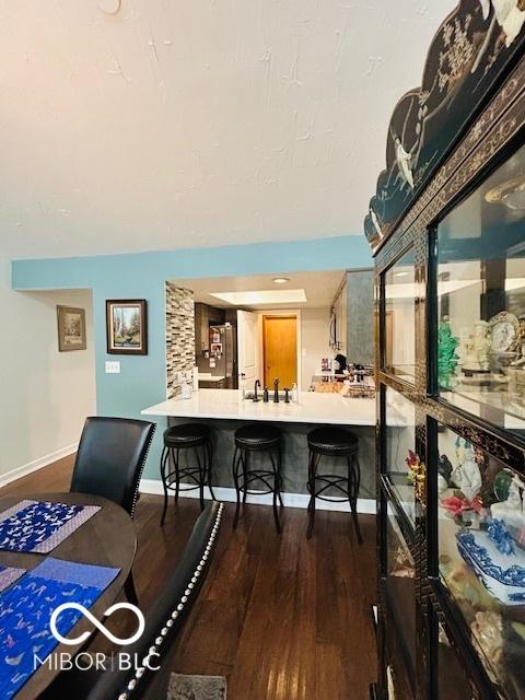 209 Brighton Ct, Greenwood, IN 46143 - dining space with dark wood finished floors and baseboards