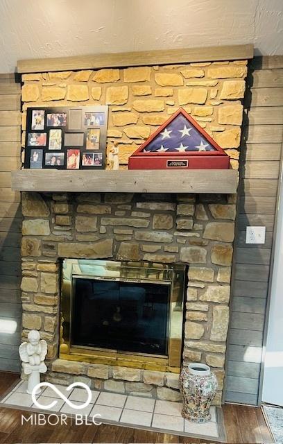 209 Brighton Ct, Greenwood, IN 46143 - detailed view of wood finished floors and a fireplace
