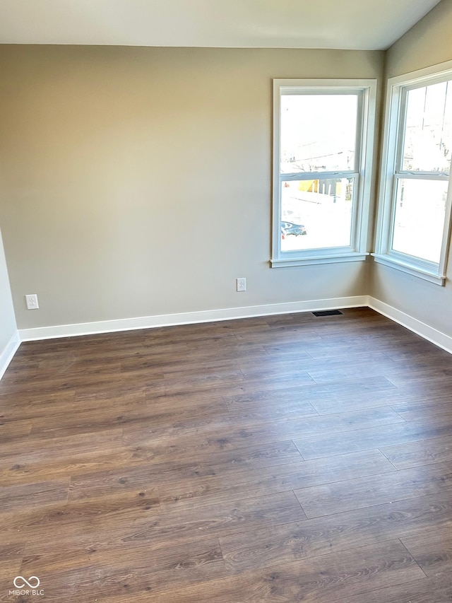 337 N Beville Ave, Indianapolis, IN 46201 - spare room with baseboards and dark wood-style flooring