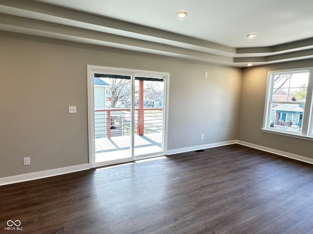 337 N Beville Ave, Indianapolis, IN 46201 - spare room featuring dark wood finished floors, baseboards, a tray ceiling, and recessed lighting