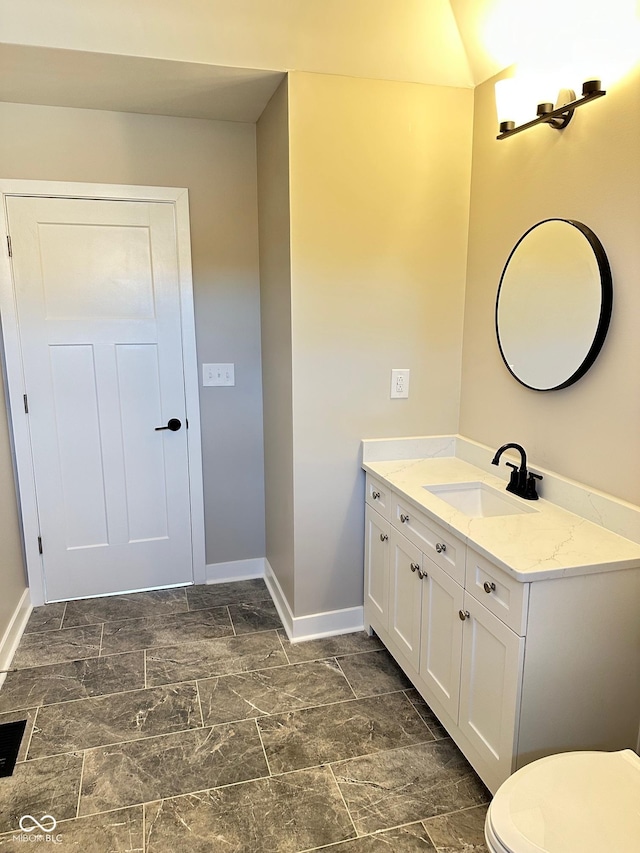 337 N Beville Ave, Indianapolis, IN 46201 - bathroom featuring baseboards, vanity, and toilet