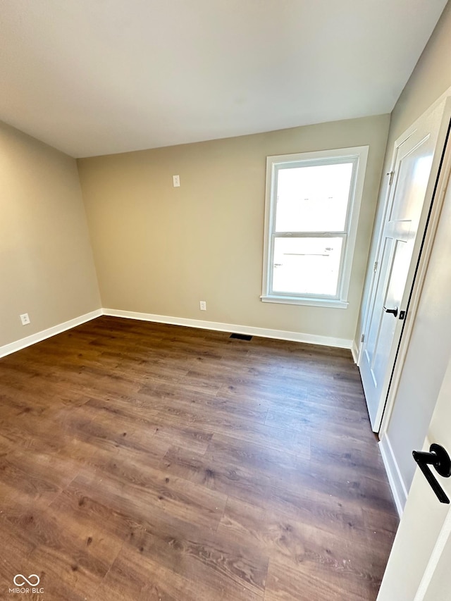 337 N Beville Ave, Indianapolis, IN 46201 - unfurnished room with dark wood-style floors and baseboards