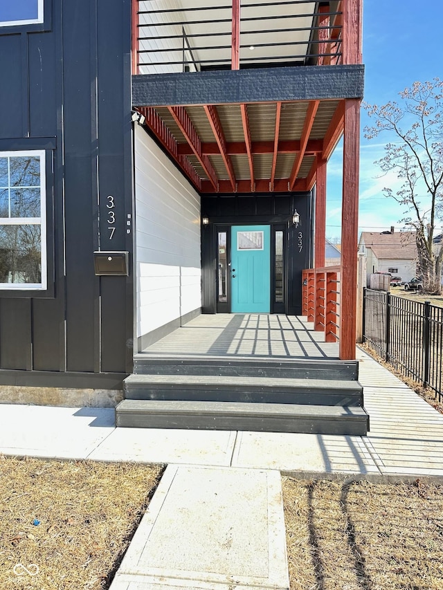 337 N Beville Ave, Indianapolis, IN 46201 - doorway to property with board and batten siding and fence