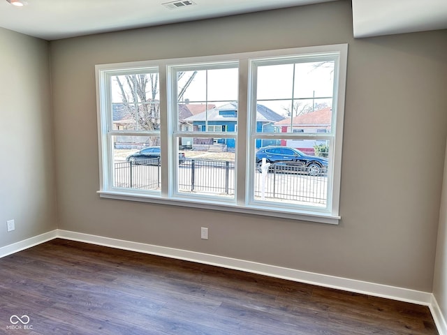 337 N Beville Ave, Indianapolis, IN 46201 - unfurnished room with dark wood-style floors and baseboards