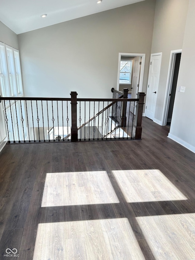 337 N Beville Ave, Indianapolis, IN 46201 - unfurnished room with baseboards, wood finished floors, and high vaulted ceiling
