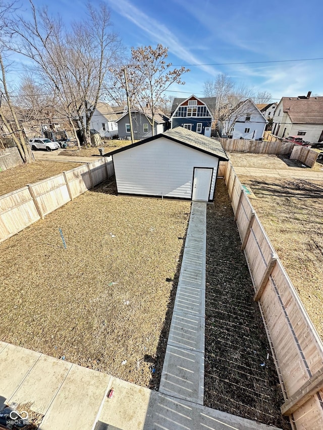 337 N Beville Ave, Indianapolis, IN 46201 - fenced backyard featuring a residential view and an outbuilding