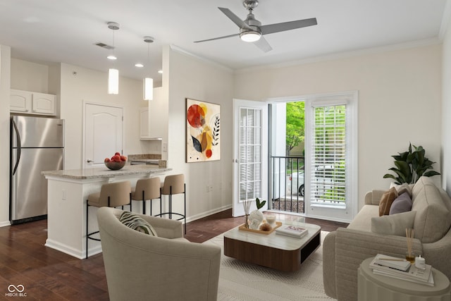 living room with dark wood-style flooring, baseboards, ornamental molding, ceiling fan, and recessed lighting