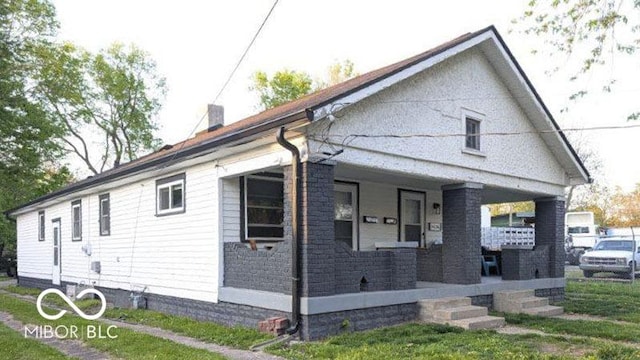 3436 Garden Ave, Indianapolis, IN 46222 - view of property exterior featuring covered porch