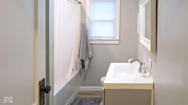 3436 Garden Ave, Indianapolis, IN 46222 - full bath featuring vanity, toilet, wood finished floors, and baseboards