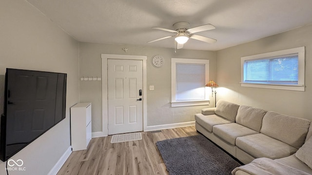 3436 Garden Ave, Indianapolis, IN 46222 - living room with ceiling fan, light wood finished floors, and baseboards