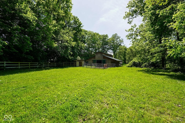 2508 Indian Creek Rd, Trafalgar, IN 46181 - view of yard featuring an outbuilding, a pole building, and a forest view