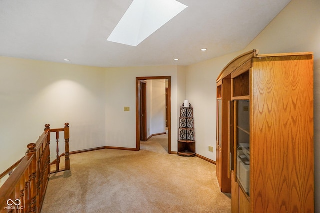 2508 Indian Creek Rd, Trafalgar, IN 46181 - spare room featuring a skylight, light colored carpet, baseboards, and recessed lighting
