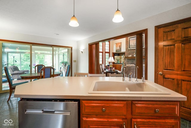 2508 Indian Creek Rd, Trafalgar, IN 46181 - kitchen featuring dishwasher, a sink, light countertops, and pendant lighting