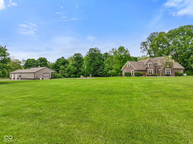 2508 Indian Creek Rd, Trafalgar, IN 46181 - view of grassy yard featuring a detached garage