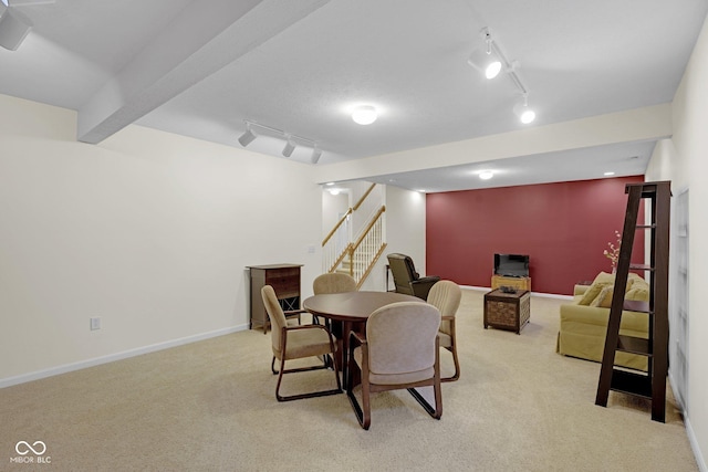 575 Dylan Dr, Avon, IN 46123 - dining area featuring carpet floors, track lighting, stairway, and baseboards