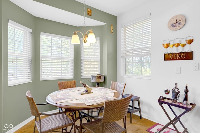 575 Dylan Dr, Avon, IN 46123 - dining space featuring a chandelier, plenty of natural light, and baseboards