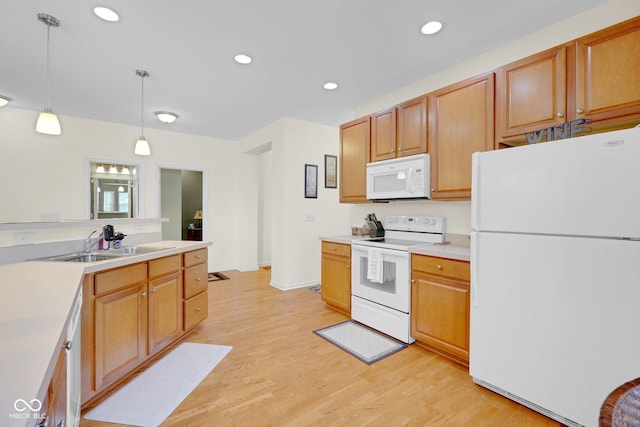 575 Dylan Dr, Avon, IN 46123 - kitchen featuring white appliances, a sink, light wood-type flooring, decorative light fixtures, and recessed lighting