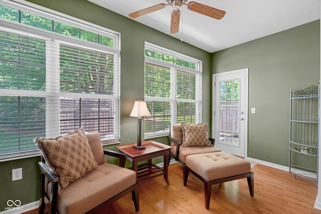 575 Dylan Dr, Avon, IN 46123 - living area with plenty of natural light, a ceiling fan, and wood finished floors