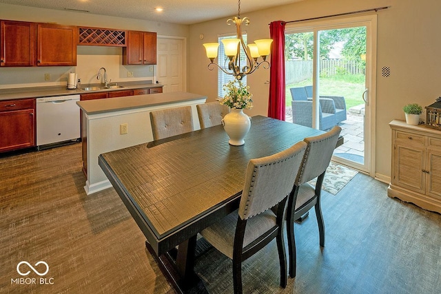10316 Hatherley Way, Fishers, IN 46037 - dining room featuring a chandelier, dark wood-type flooring, recessed lighting, and baseboards