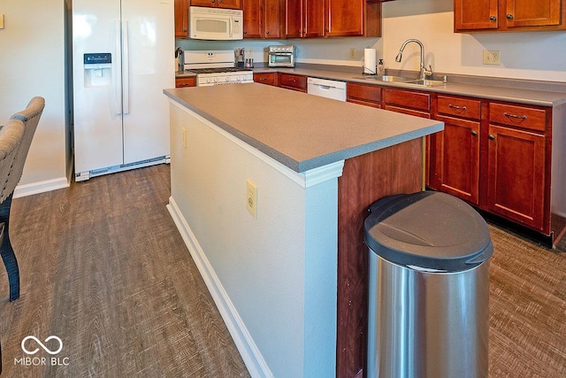 10316 Hatherley Way, Fishers, IN 46037 - kitchen with white appliances, a sink, a center island, and baseboards