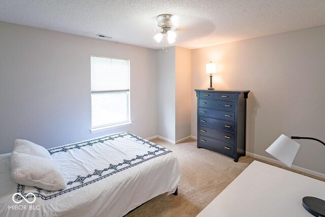 10316 Hatherley Way, Fishers, IN 46037 - bedroom featuring light carpet, a textured ceiling, and baseboards