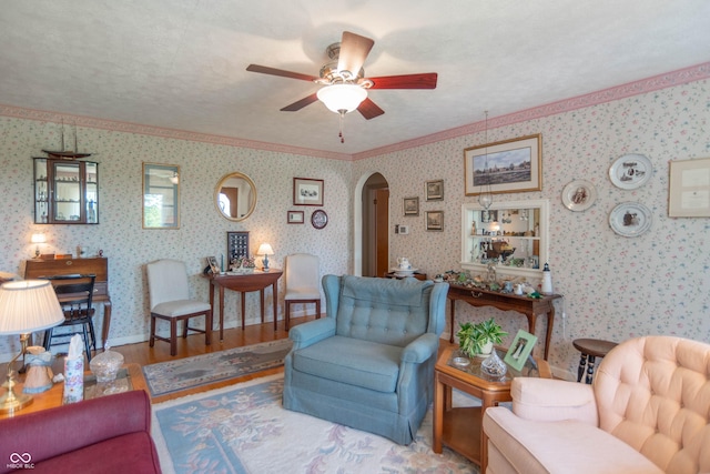 295 Maple Turn Rd, Martinsville, IN 46151 - living area with arched walkways, wood finished floors, a ceiling fan, and ornamental molding