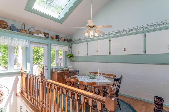 295 Maple Turn Rd, Martinsville, IN 46151 - dining space featuring vaulted ceiling, wood finished floors, ceiling fan, and a skylight