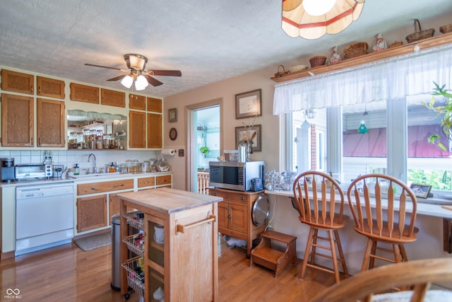 295 Maple Turn Rd, Martinsville, IN 46151 - kitchen featuring white dishwasher, open shelves, stainless steel microwave, light countertops, and a ceiling fan
