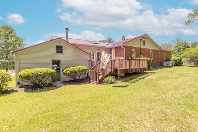 295 Maple Turn Rd, Martinsville, IN 46151 - rear view of property featuring a lawn, a wooden deck, metal roof, and a chimney