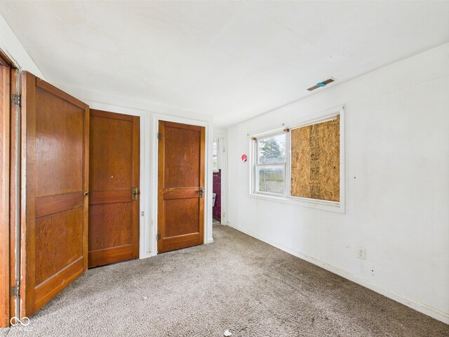29 E Pine St, Anderson, IN 46012 - unfurnished bedroom featuring carpet and baseboards