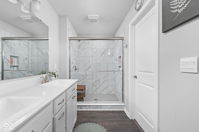 2542 Barstow Dr, Whitestown, IN 46075 - full bath featuring wood finished floors, a stall shower, and double vanity