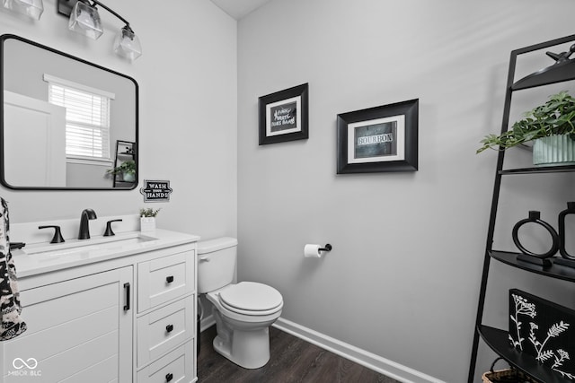 2542 Barstow Dr, Whitestown, IN 46075 - half bath with wood finished floors, toilet, vanity, and baseboards