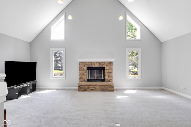 10602 Fall Rd, Fishers, IN 46037 - unfurnished living room featuring high vaulted ceiling, carpet floors, a glass covered fireplace, and baseboards