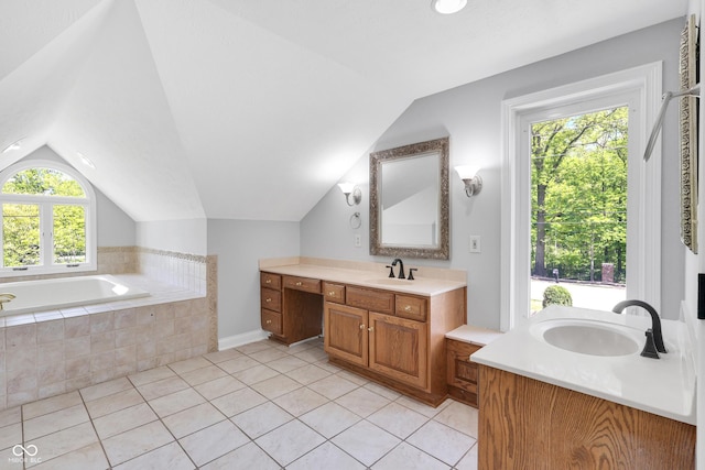 10602 Fall Rd, Fishers, IN 46037 - bathroom with lofted ceiling, tile patterned floors, two vanities, and a bath
