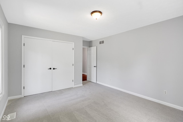 10602 Fall Rd, Fishers, IN 46037 - unfurnished bedroom with light colored carpet, a closet, and baseboards