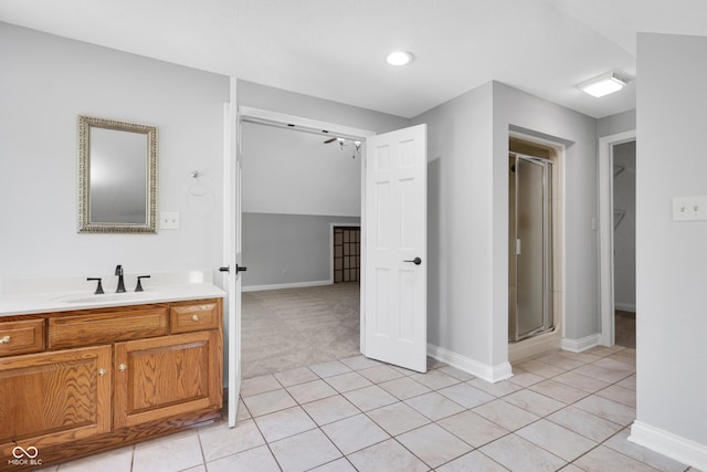 10602 Fall Rd, Fishers, IN 46037 - bathroom with baseboards, a stall shower, tile patterned floors, and vanity