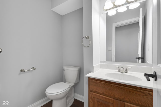 10602 Fall Rd, Fishers, IN 46037 - bathroom with toilet, baseboards, and vanity