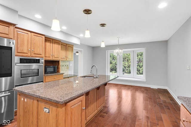 10602 Fall Rd, Fishers, IN 46037 - kitchen featuring oven, black microwave, refrigerator, a sink, and light stone countertops