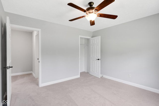 10602 Fall Rd, Fishers, IN 46037 - unfurnished bedroom with light colored carpet, baseboards, a closet, and a ceiling fan