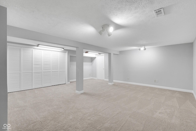 10602 Fall Rd, Fishers, IN 46037 - finished below grade area with a textured ceiling, carpet, and baseboards