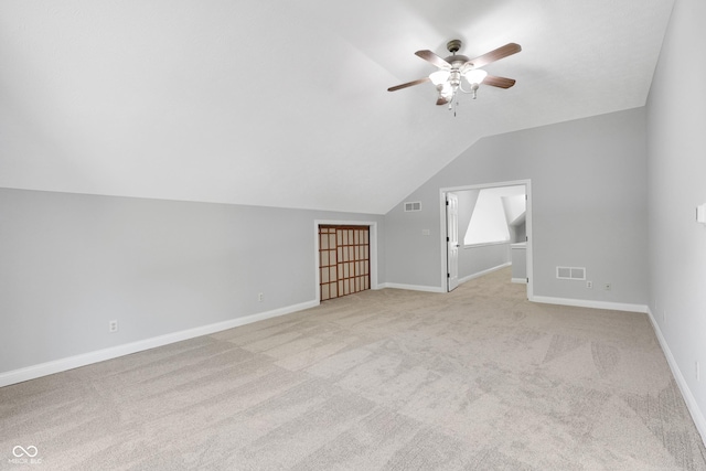 10602 Fall Rd, Fishers, IN 46037 - additional living space featuring a ceiling fan, light colored carpet, vaulted ceiling, and baseboards