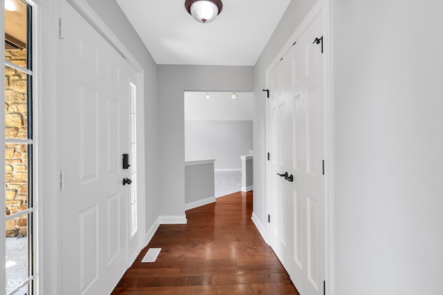 10602 Fall Rd, Fishers, IN 46037 - foyer with dark wood-style flooring and baseboards