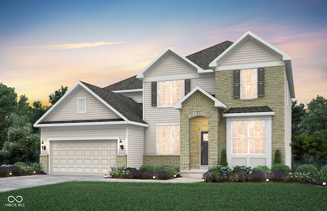traditional-style home featuring brick siding, a shingled roof, a front yard, and a garage