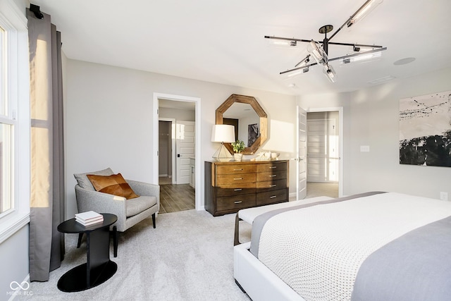 bedroom featuring light colored carpet