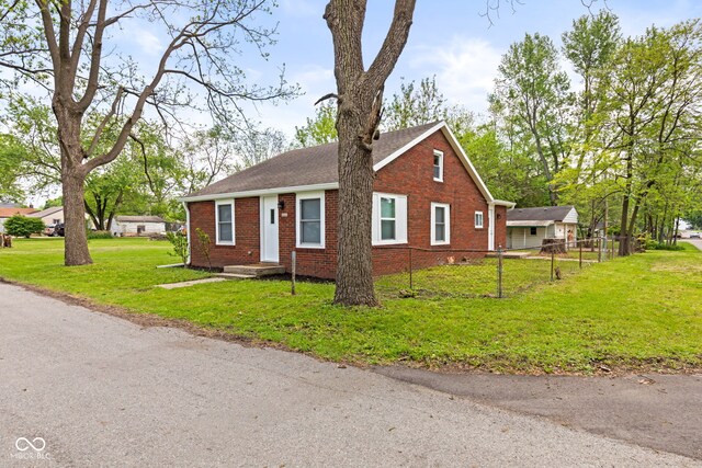 2321 W 26th St, Anderson, IN 46016 - view of front of house with brick siding and roof with shingles