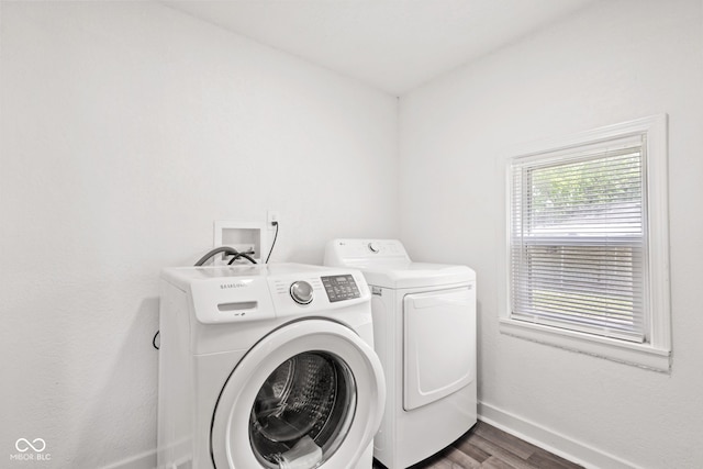 2321 W 26th St, Anderson, IN 46016 - washroom with washer and clothes dryer, baseboards, and dark wood-type flooring