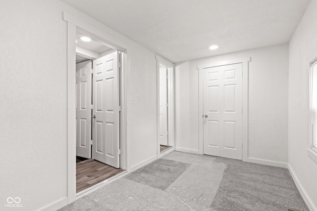2321 W 26th St, Anderson, IN 46016 - hall featuring baseboards, recessed lighting, and carpet