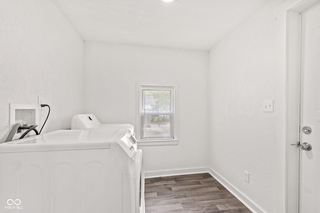 2321 W 26th St, Anderson, IN 46016 - laundry area featuring washer and dryer, dark wood-style flooring, and baseboards