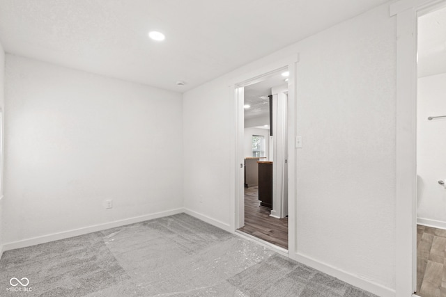 2321 W 26th St, Anderson, IN 46016 - unfurnished bedroom with carpet, baseboards, and recessed lighting